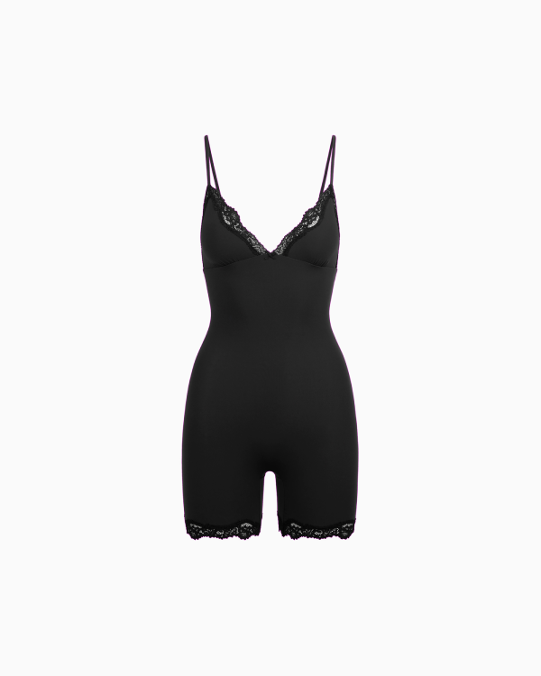 A MODEL POSES WEARING SKIMS CATSUITS &amp; ONESIES