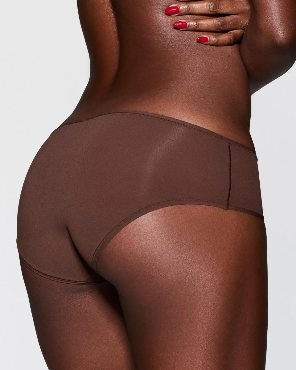 A MODEL POSES WEARING CHEEKY UNDERWEAR