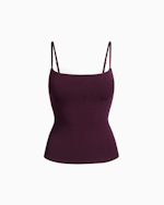 A MODEL POSES WEARING SKIMS COTTON RIB TANK