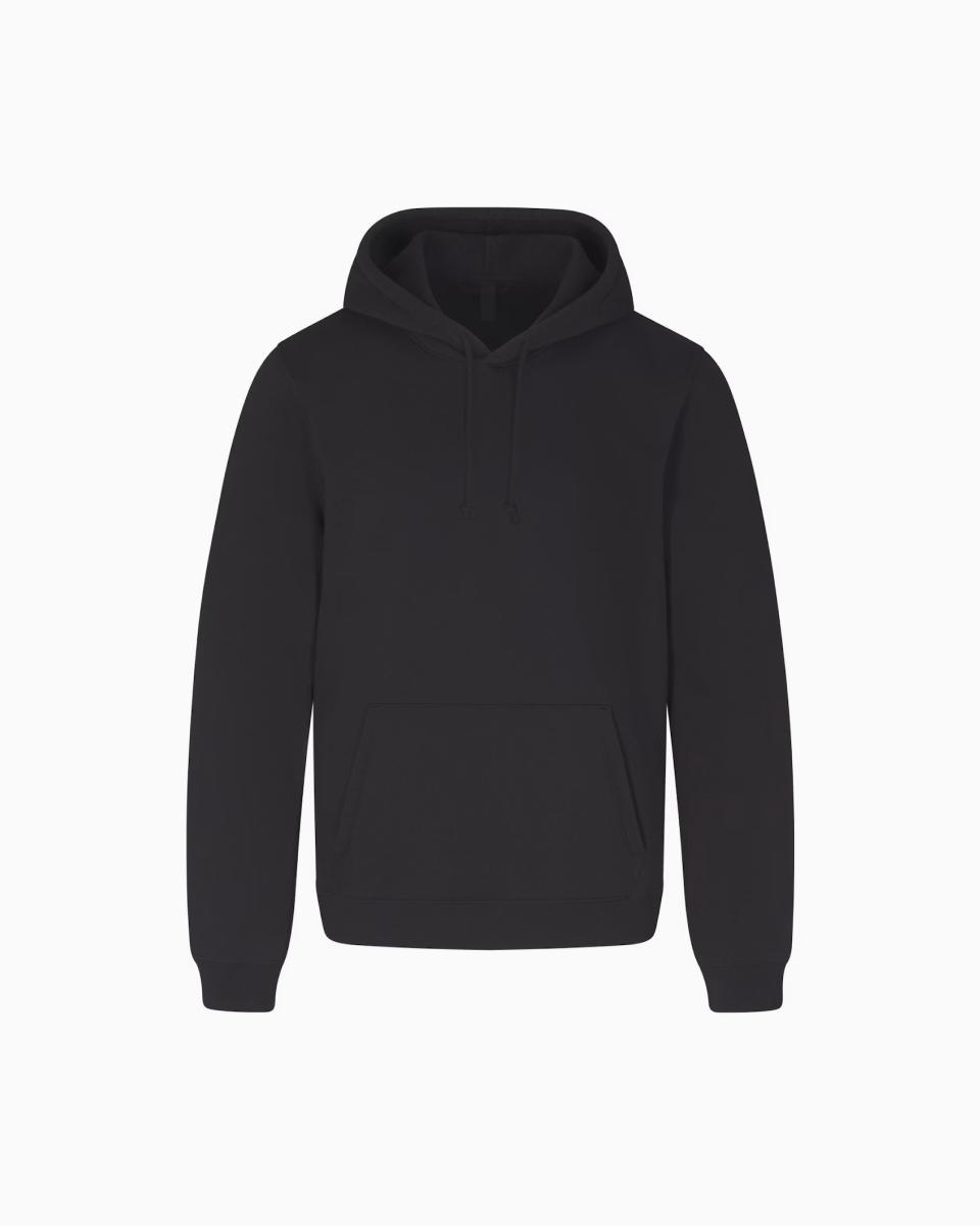 A model poses wearing Hoodies & Sweatshirts