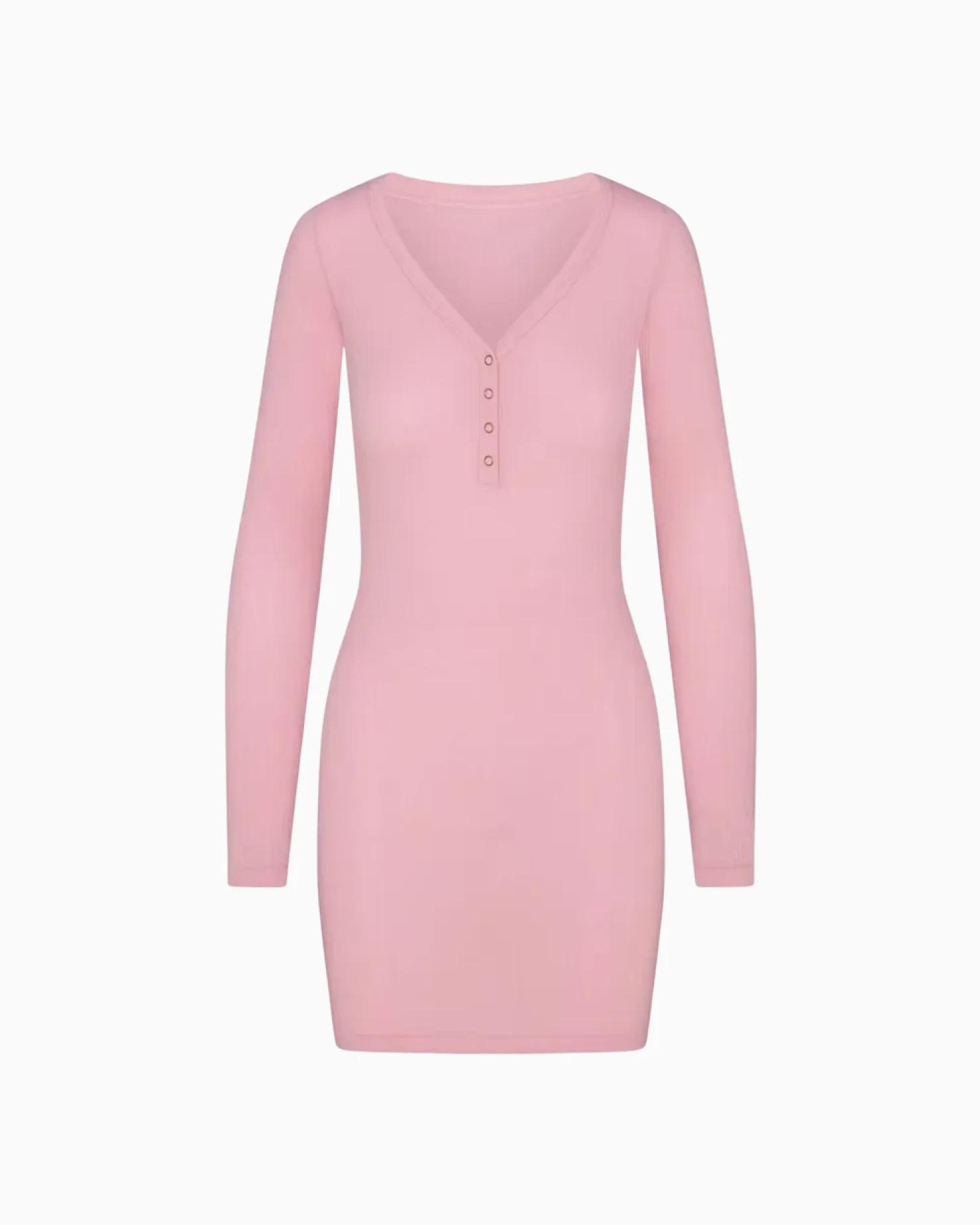 A MODEL POSES WEARING SKIMS SHORTS