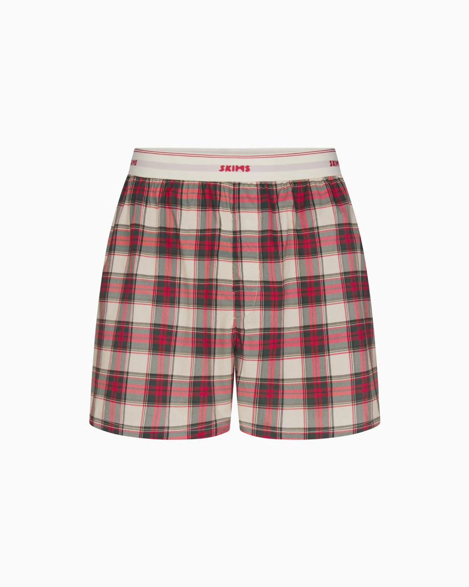 A MODEL POSES WEARING SKIMS MENS BOXERS