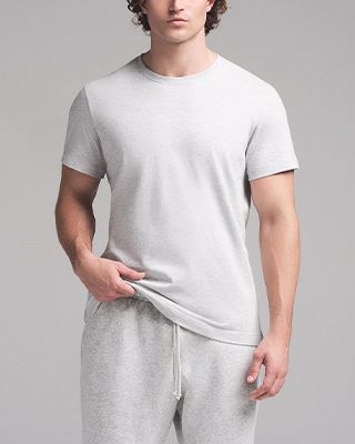 A model poses wearing SKIMS MENS COTTON