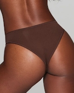 A MODEL POSES WEARING CHEEKY UNDERWEAR