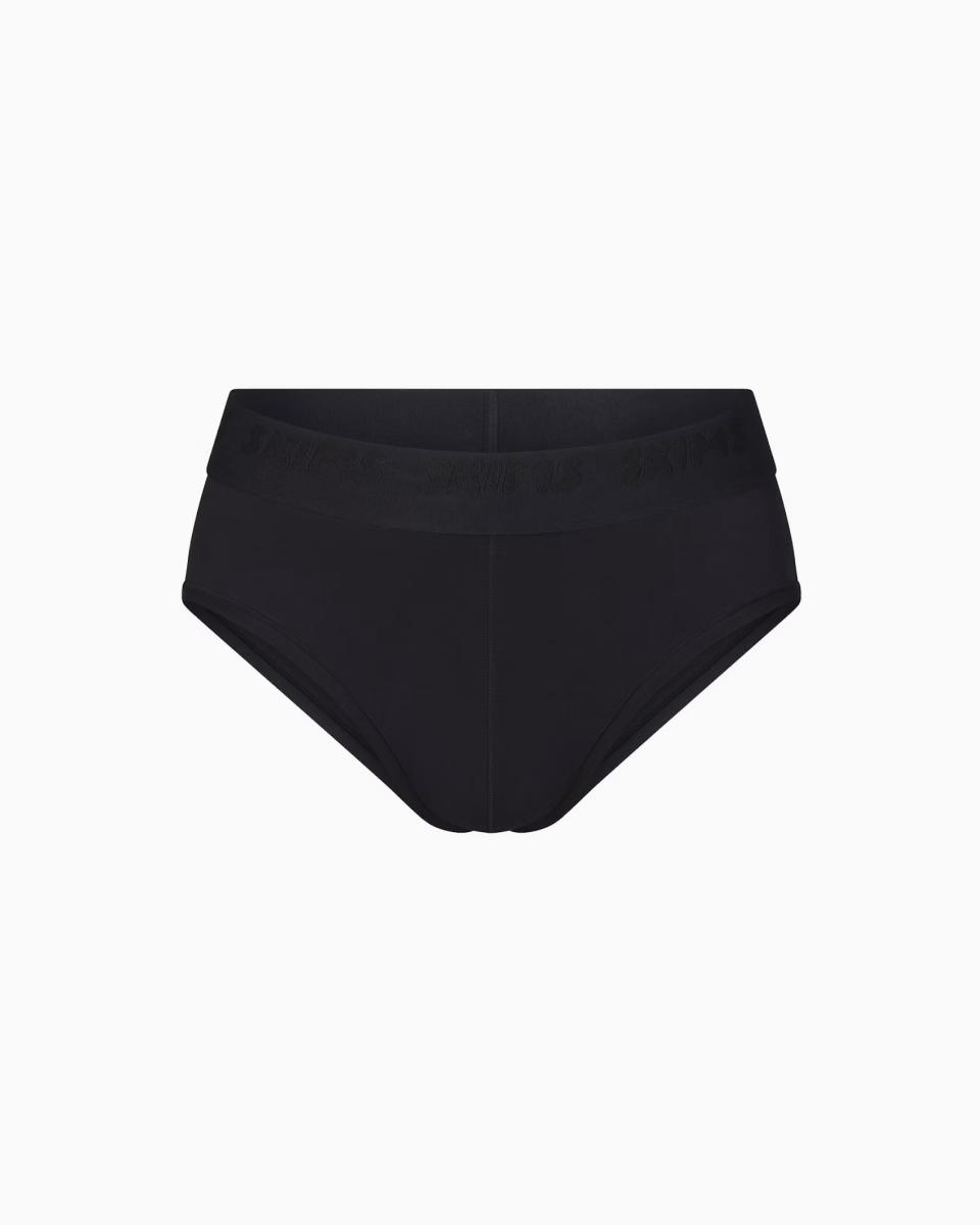 A MODEL POSES WEARING SKIMS MENS Briefs