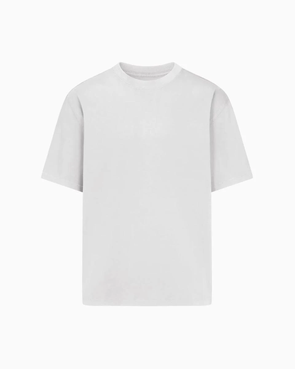 A MODEL POSES WEARING SKIMS MENS STRETCH T-SHIRT