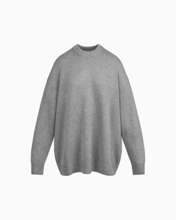 A MODEL POSES WEARING SKIMS DRESSES