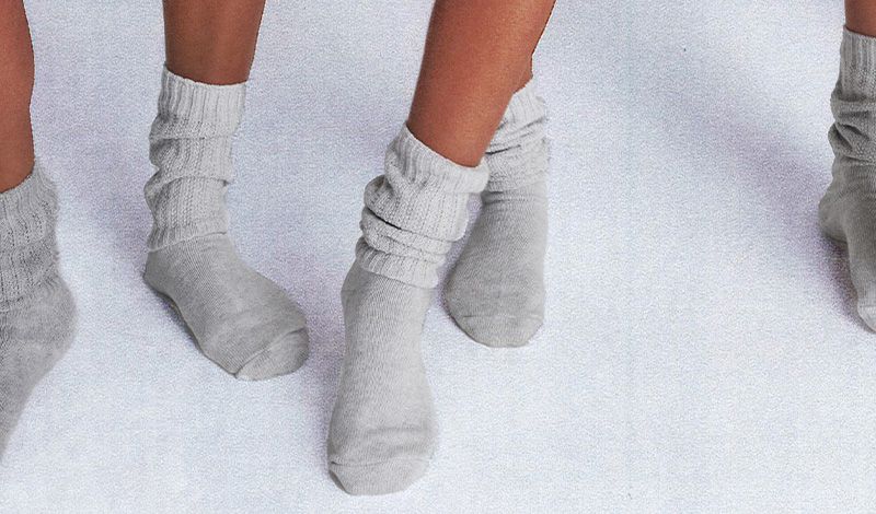 Women’s feet shown close up wearing different color and style socks