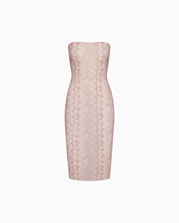 A MODEL POSES WEARING SKIMS SHORTS