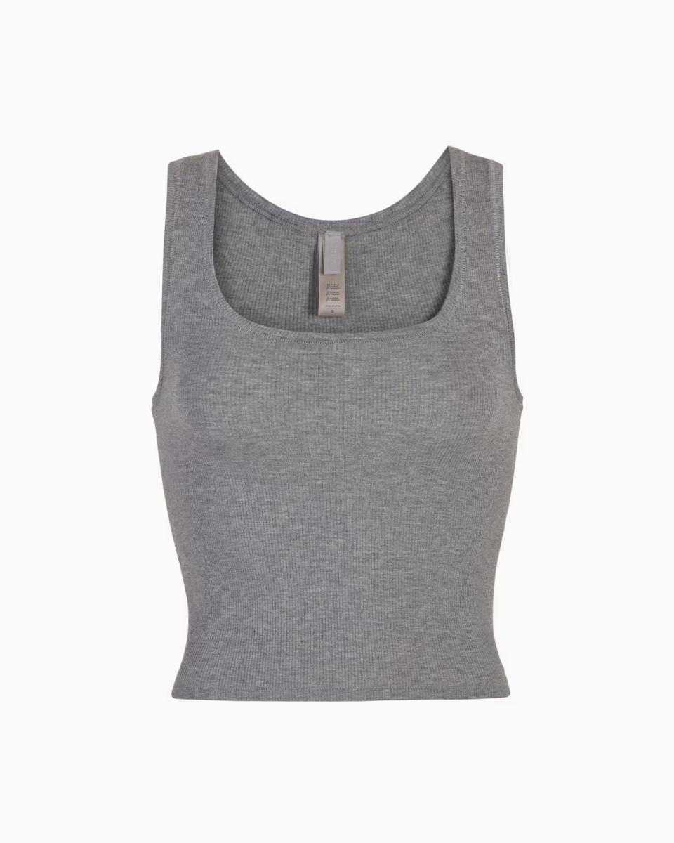 A MODEL POSES WEARING SKIMS COTTON RIB IN KYANITE