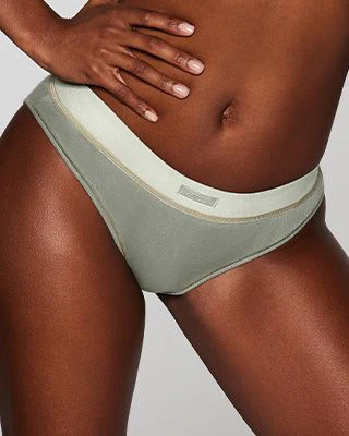 A MODEL POSES WEARING SKIMS BRIEFS