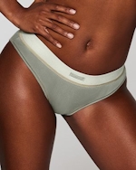 A MODEL POSES WEARING SKIMS BRIEFS