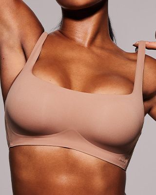 A MODEL POSES WEARING WIRELESS BRAS