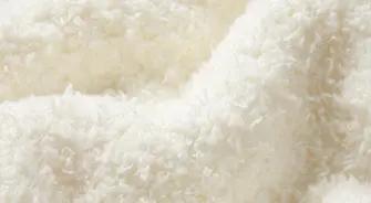 A MODEL POSES WEARING SKIMS COZY