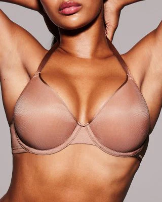 A MODEL POSES WEARING DEMI BRAS