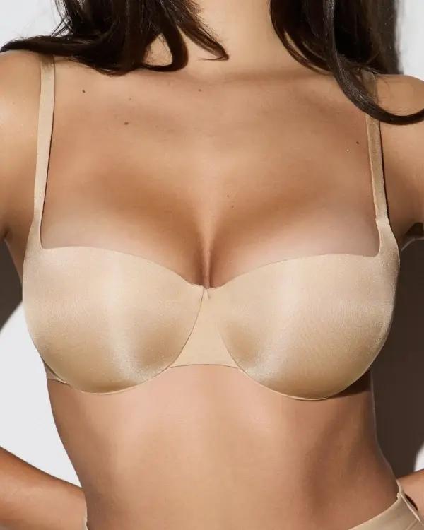 A MODEL POSES WEARING BALCONETTE BRA